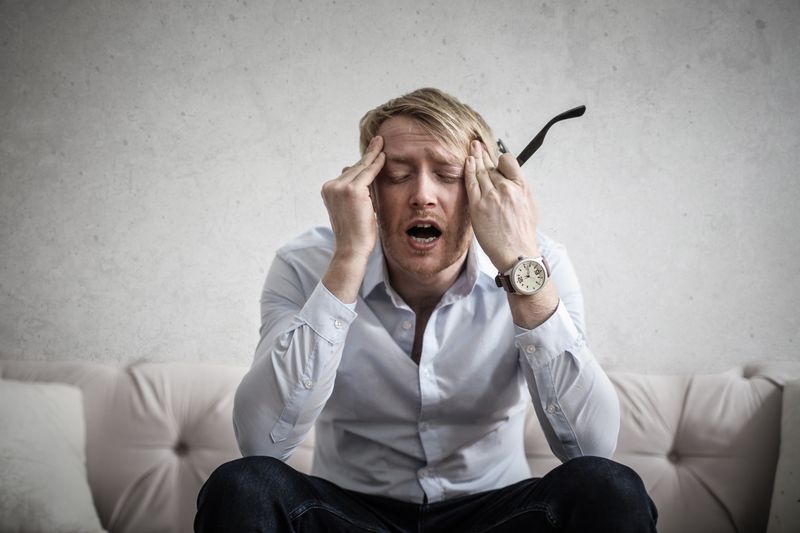 Person with neck pain and stiffness representing whiplash after a car accident